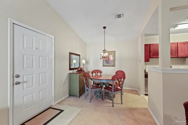 a view of a dining room with furniture