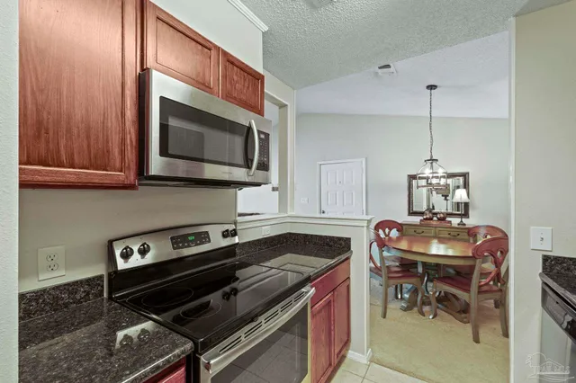a kitchen with a stove and a microwave