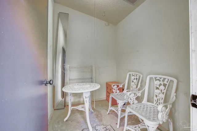 a view of a balcony with wooden floor