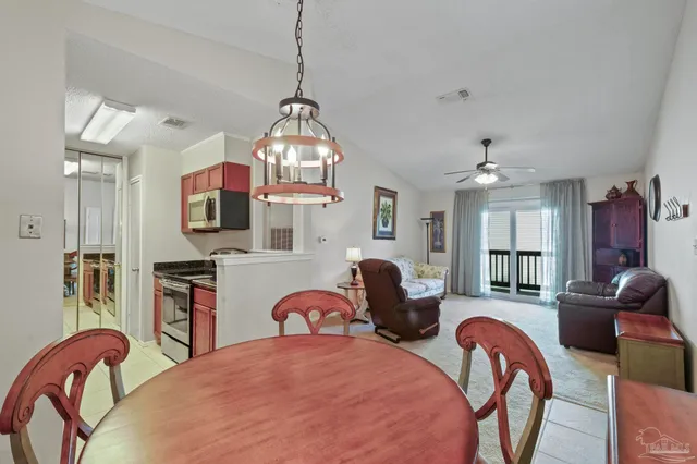 a bedroom with furniture and a chandelier