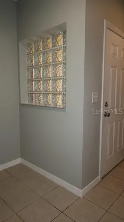 a kitchen with a sink and a refrigerator