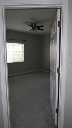 a view of a livingroom with a ceiling fan