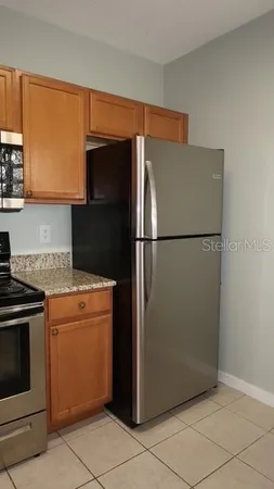 a stove top oven sitting inside of a kitchen