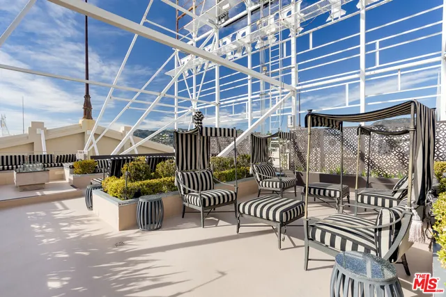 a view of balcony with furniture