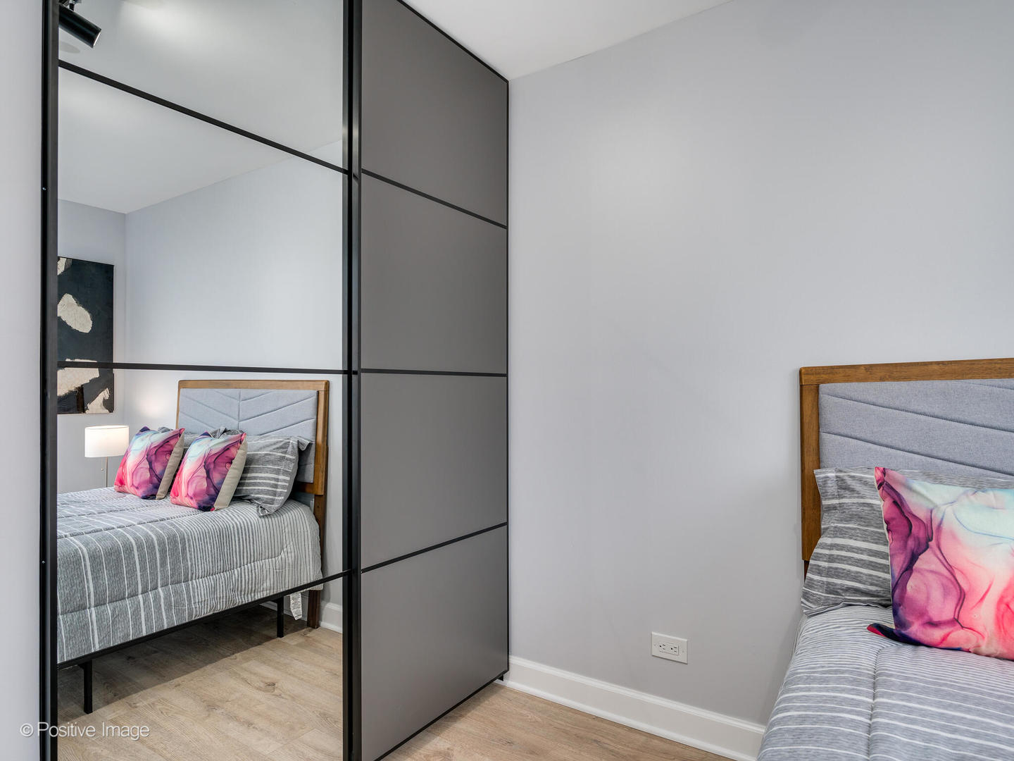 5455 North Sheridan Road, Unit 1511 Chicago, IL 60640 - Photo 12 of 25 a bedroom with a bed and a couch