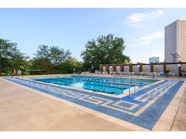 5455 North Sheridan Road, Unit 1511 Chicago, IL 60640 - Photo 20 of 25 a view of a swimming pool with a yard