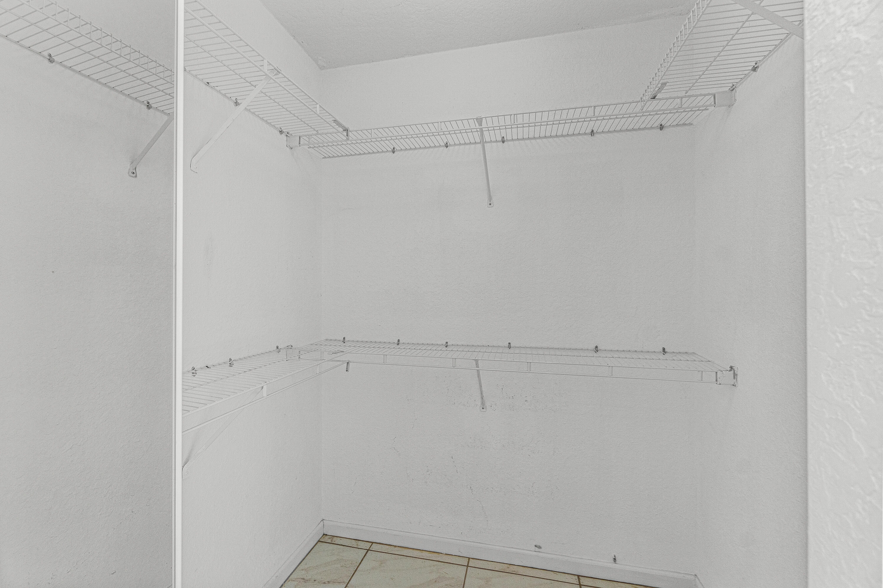 4263 Northwest 29th Way Boca Raton, FL 33434 - Photo 11 of 21 Walk-in Closet in Primary Suite #1