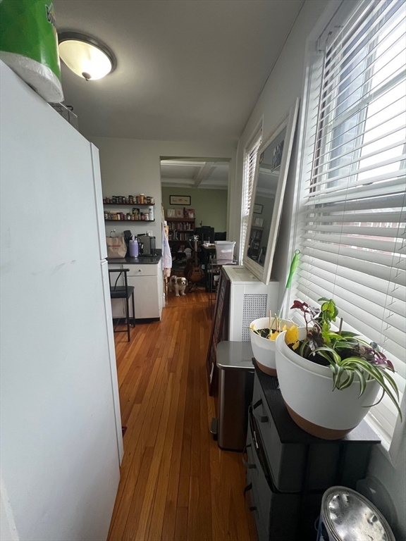 110 Lanark Road, Unit 5 Boston, MA 02135 - Photo 15 of 17 a living room with furniture and a wooden floor