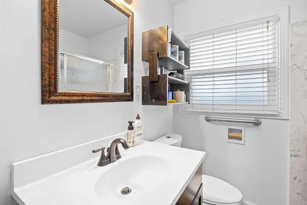 a front view of a house with a large window and table