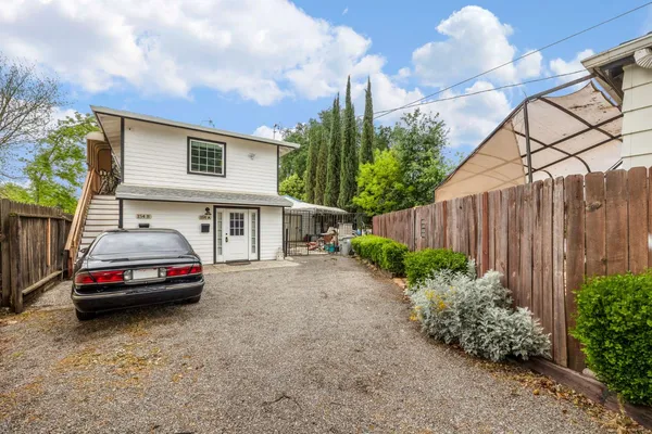 a kitchen with a stove a sink and a microwave