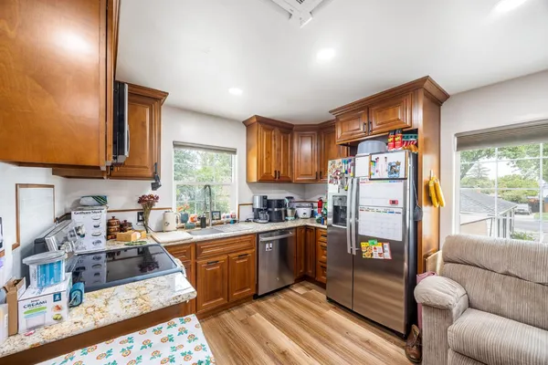 a view of a hallway with wooden floor