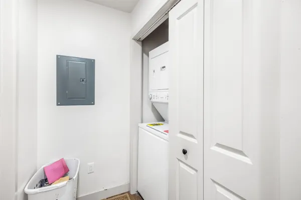 a kitchen with stainless steel appliances granite countertop a sink refrigerator and cabinets