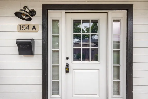 a kitchen with a stove a sink and a microwave