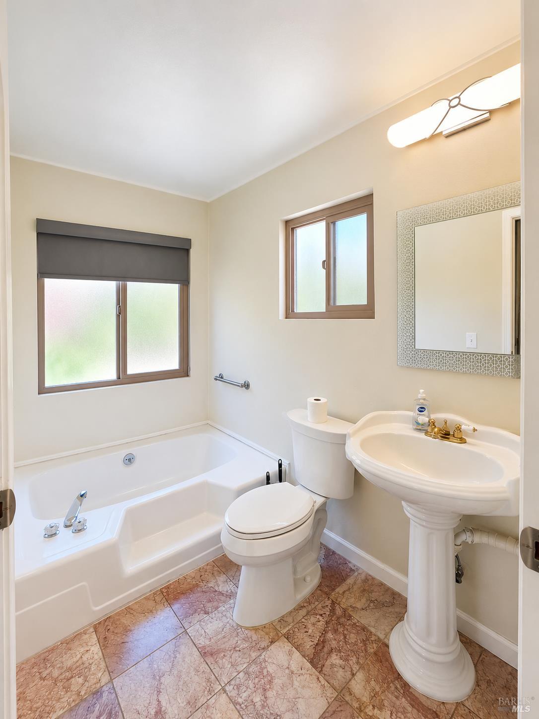 1945 Piner Road, Unit 16 Santa Rosa, CA 95403 - Photo 13 of 18 a bathroom with a sink toilet and a bathtub