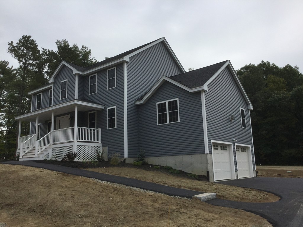 79 Merrimac Road Haverhill, MA 01830 - Photo 1 of 13 a front view of a house with a yard