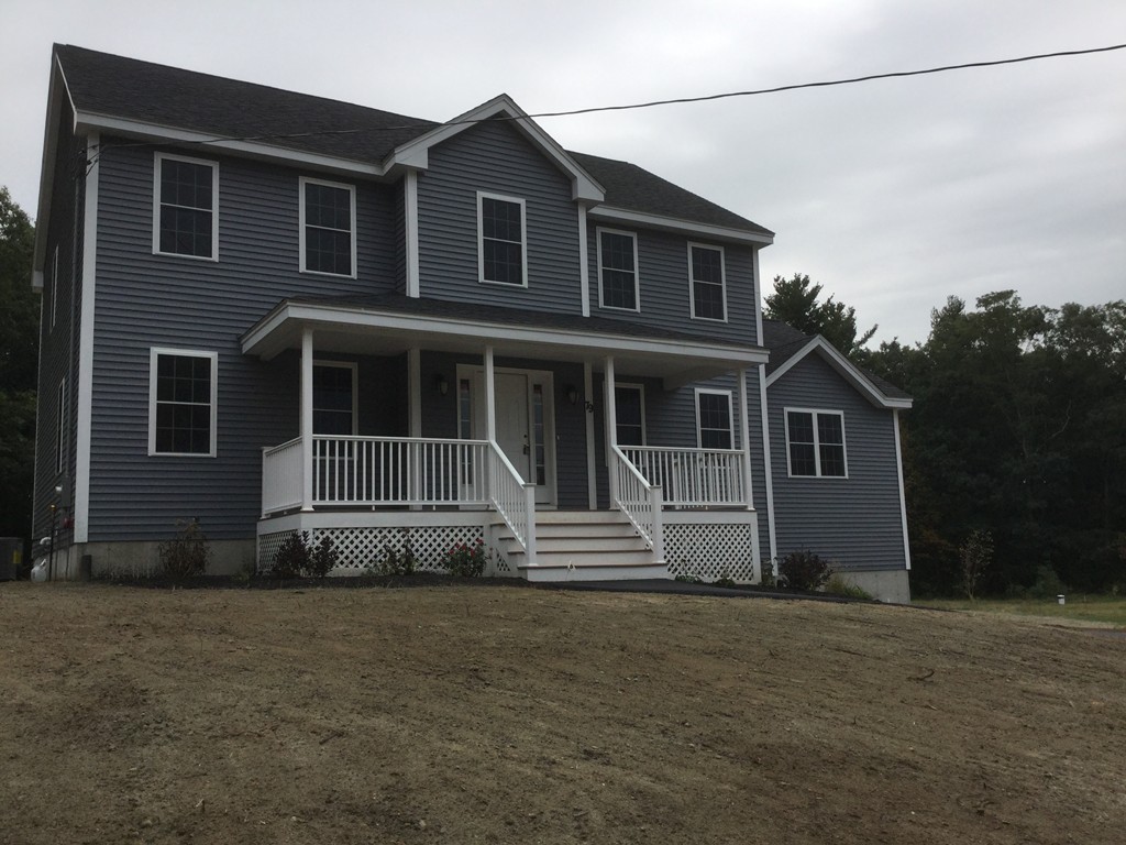79 Merrimac Road Haverhill, MA 01830 - Photo 2 of 13 a front view of a house with a yard