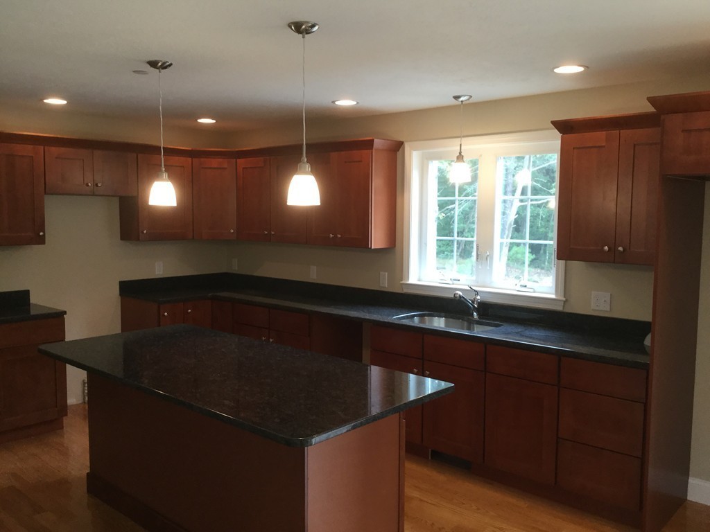 79 Merrimac Road Haverhill, MA 01830 - Photo 5 of 13 a kitchen with a sink a counter space appliances and a window