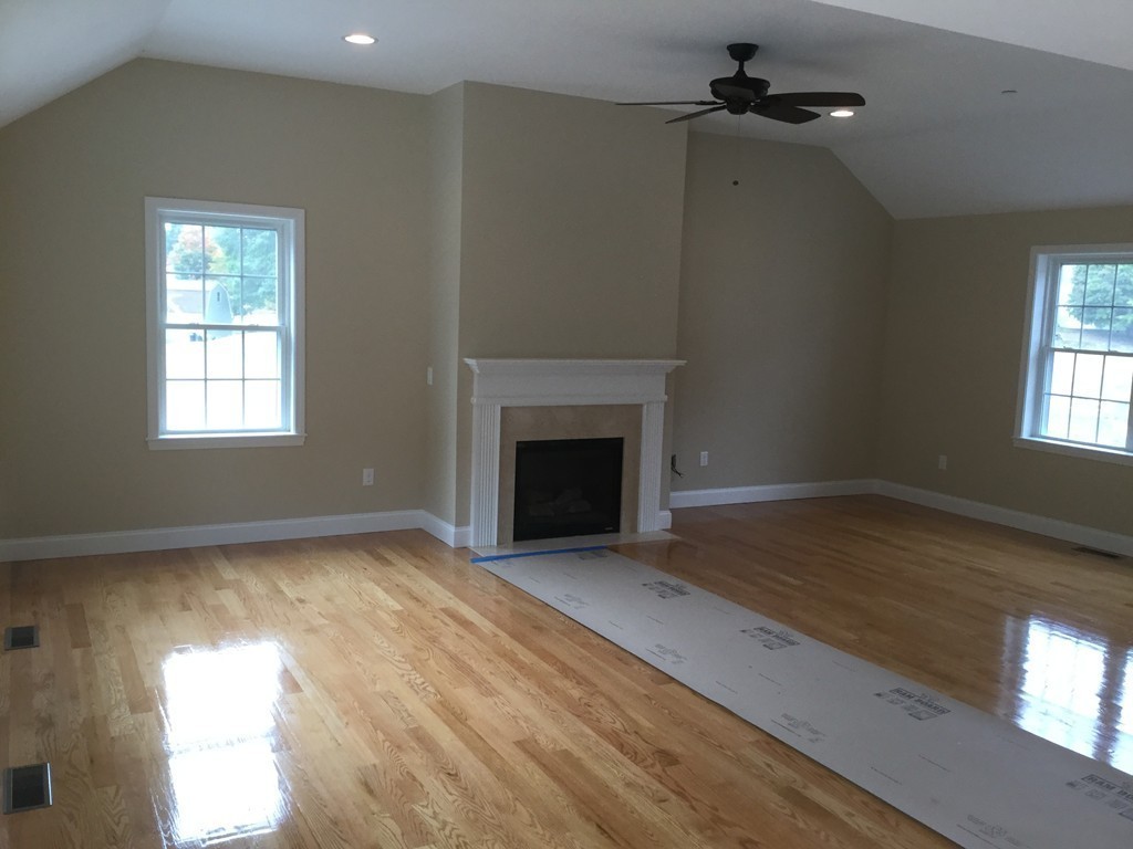 79 Merrimac Road Haverhill, MA 01830 - Photo 9 of 13 a view of an empty room with a window and wooden floor