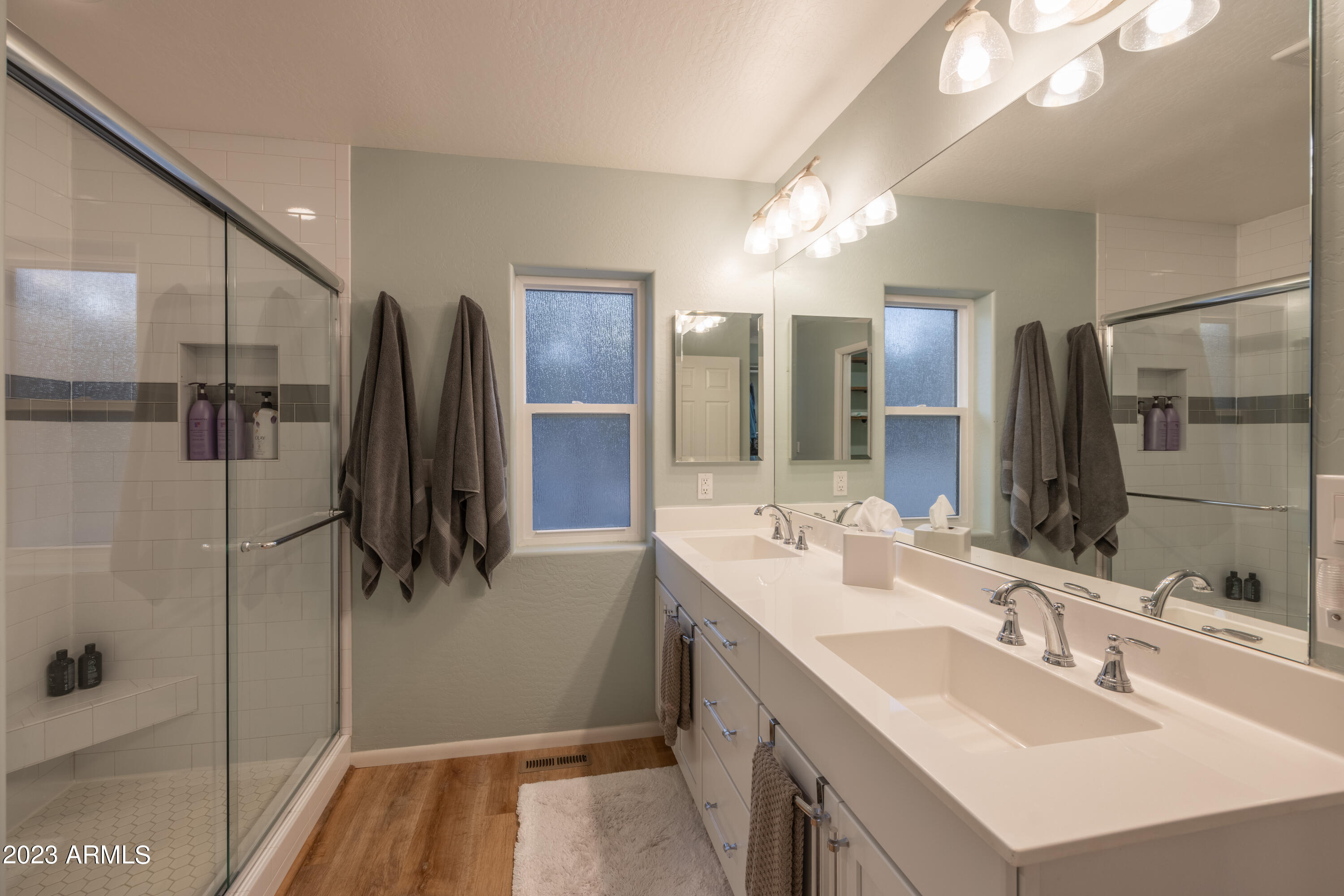2772 Larson Loop Forest Lakes, AZ 85931 - Photo 21 of 65 a bathroom with a double vanity sink a mirror and shower