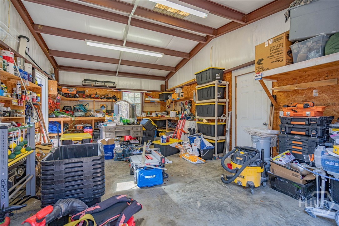 401 Magnolia Bluff Road Statesboro, GA 30461 - Photo 59 of 73 Insulated shop with electricity, shelving and bay door.