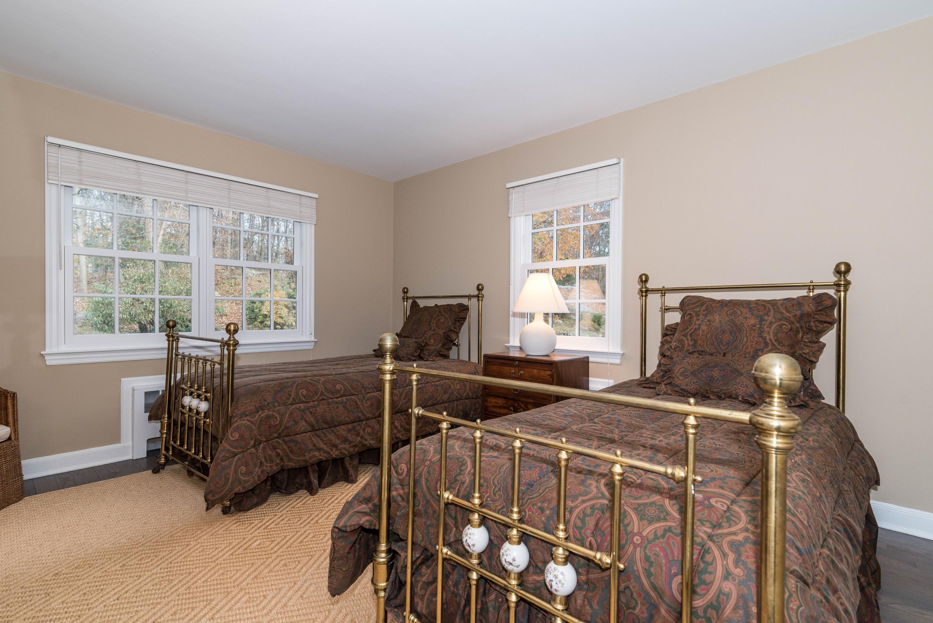 782 Smith Ridge Road New Canaan, CT 06840 - Photo 16 of 25 a bedroom with two beds and a window