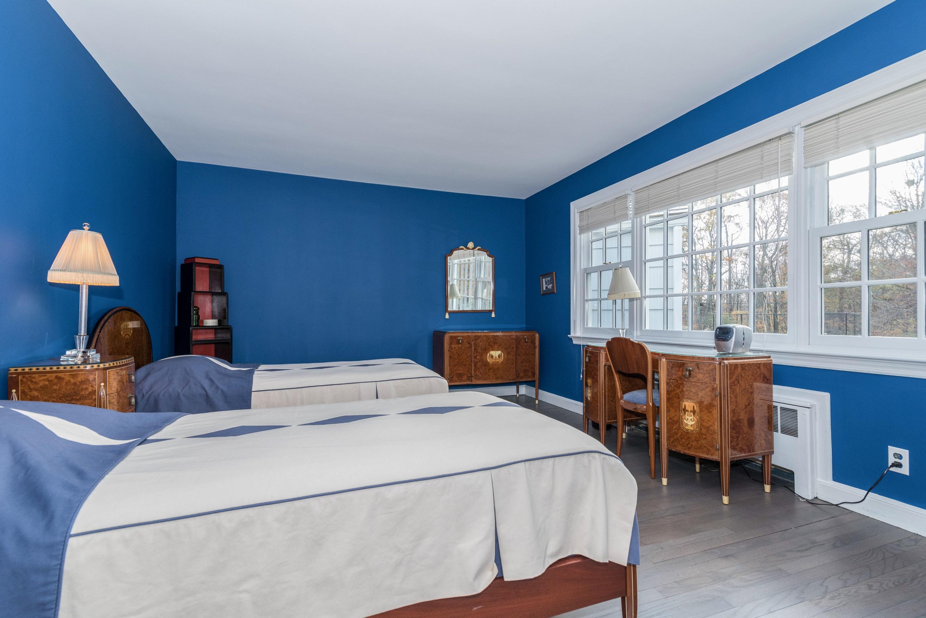 782 Smith Ridge Road New Canaan, CT 06840 - Photo 17 of 25 a bedroom with bed and a window