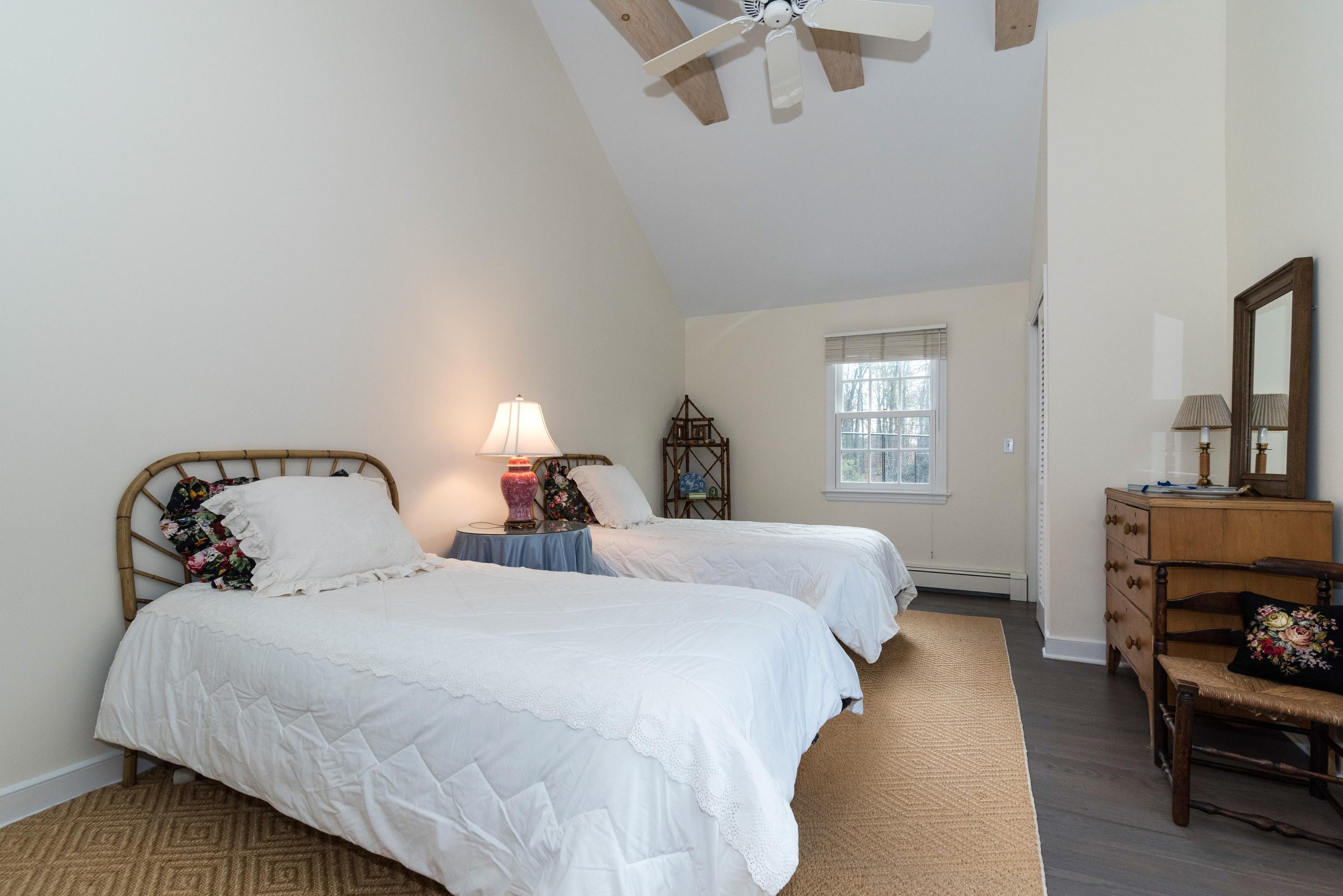 782 Smith Ridge Road New Canaan, CT 06840 - Photo 18 of 25 a bedroom with a bed and a fireplace