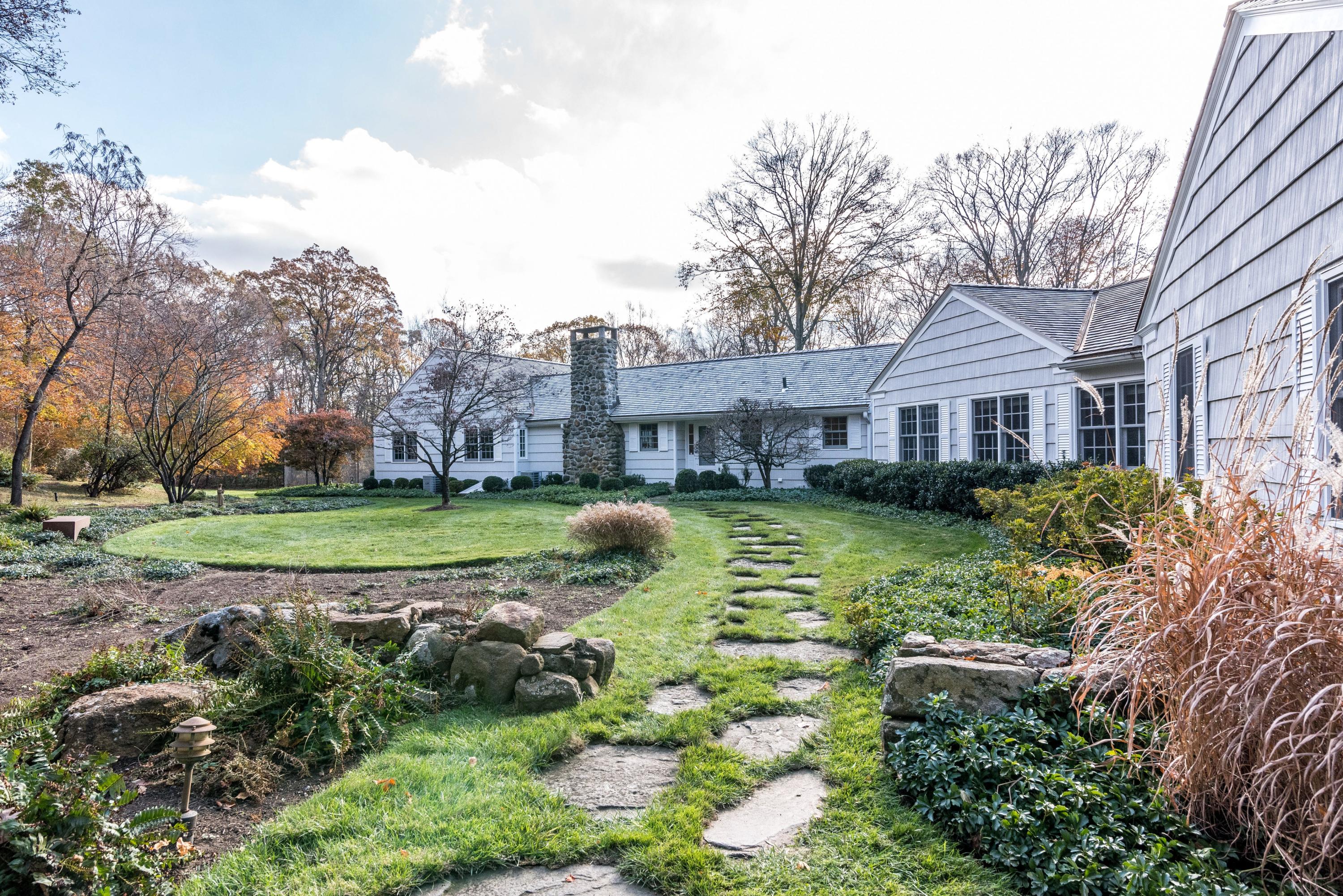 782 Smith Ridge Road New Canaan, CT 06840 - Photo 2 of 25 a view of a house with a big yard plants and large trees