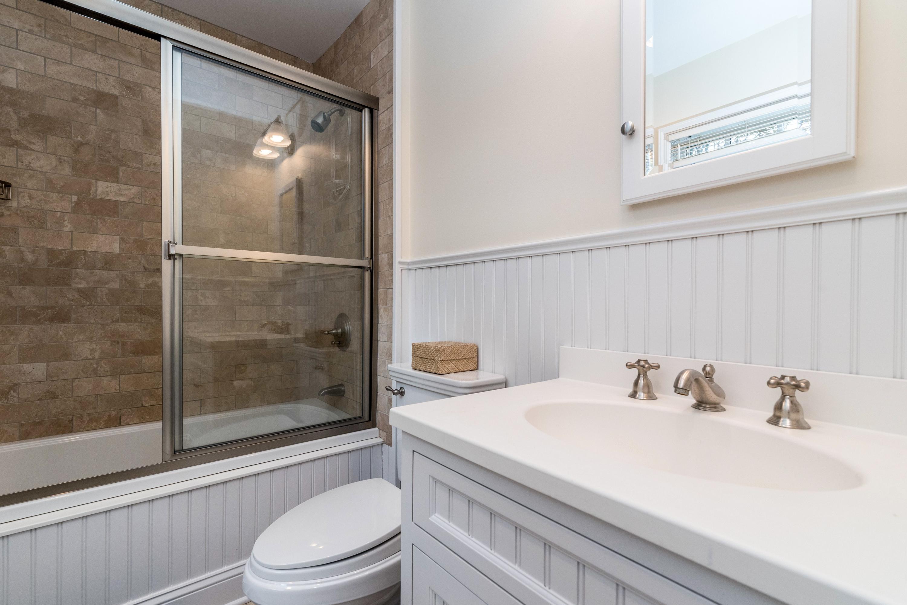 782 Smith Ridge Road New Canaan, CT 06840 - Photo 21 of 25 a bathroom with a sink toilet and shower