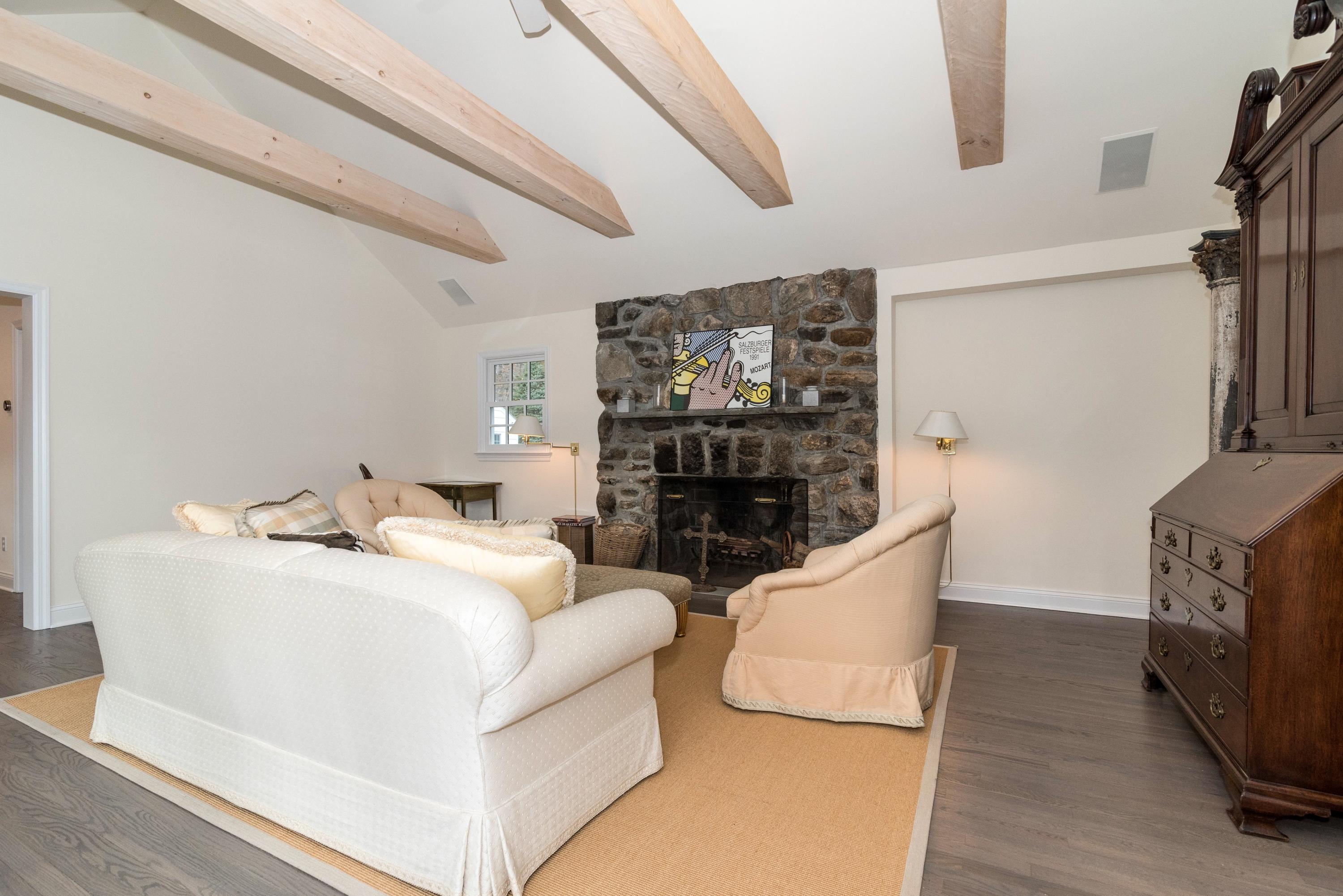 782 Smith Ridge Road New Canaan, CT 06840 - Photo 4 of 25 a living room with furniture and a flat screen tv