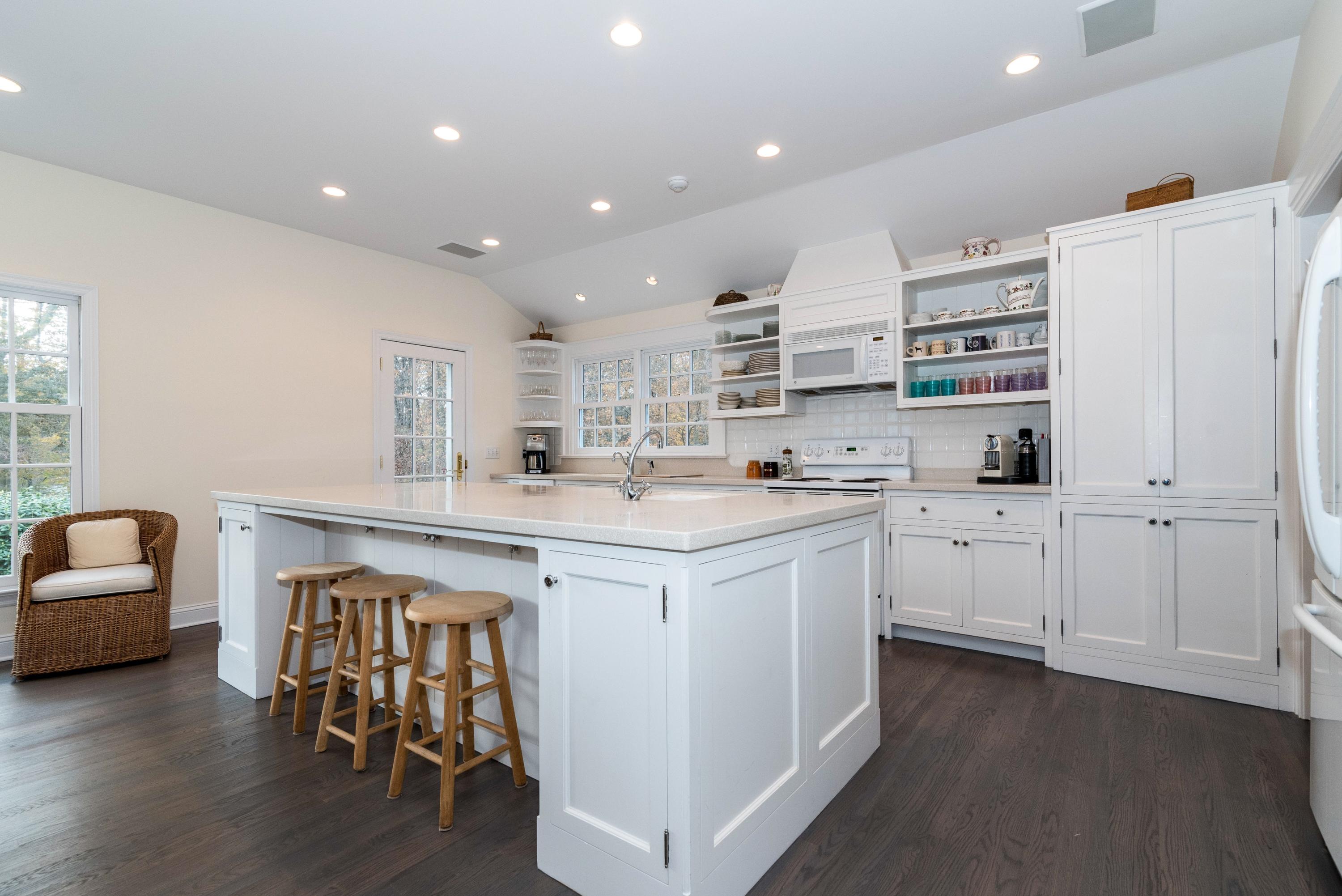 782 Smith Ridge Road New Canaan, CT 06840 - Photo 6 of 25 a kitchen with cabinets and wooden floor