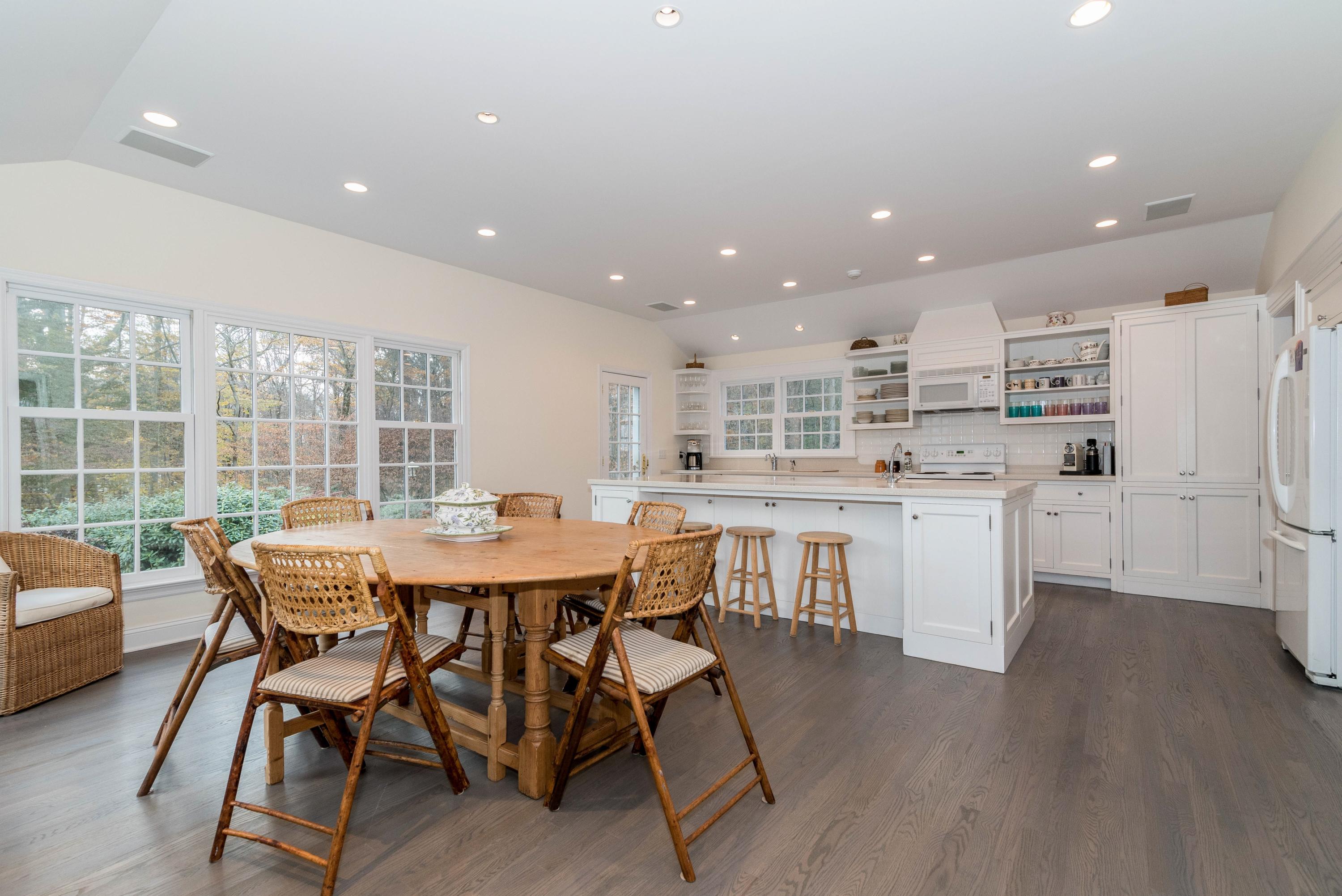 782 Smith Ridge Road New Canaan, CT 06840 - Photo 7 of 25 a view of a dining room with furniture and wooden floor