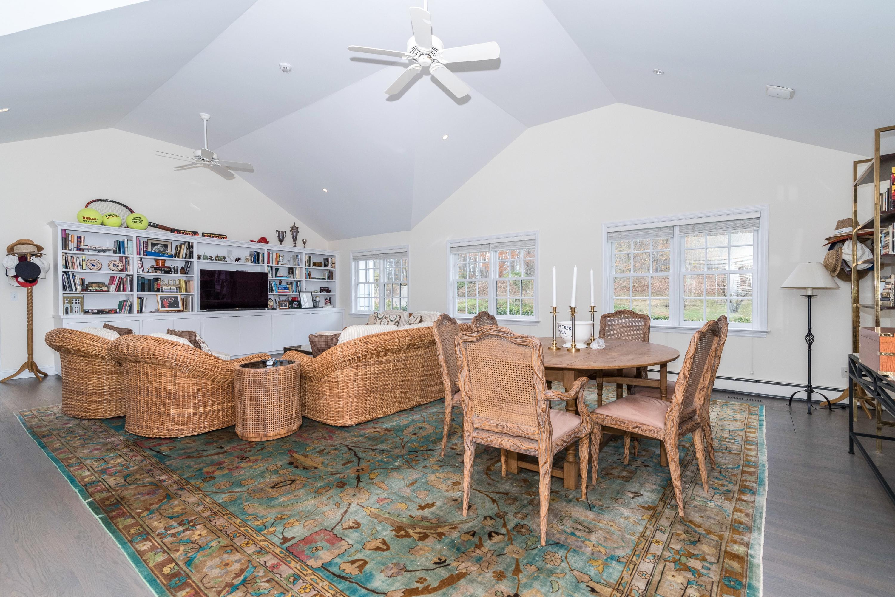 782 Smith Ridge Road New Canaan, CT 06840 - Photo 10 of 25 a dining room with furniture a rug and wooden floor