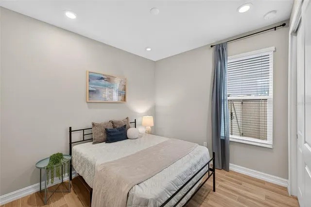 a view of a dining room with furniture wooden floor and chandelier