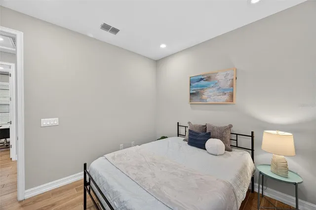 a kitchen with kitchen island a stove a table and chairs in it