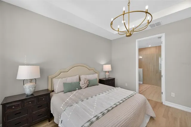 a view of a house with a yard and potted plants