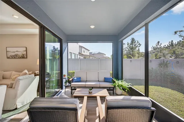 a view of a swimming pool with a table and chairs