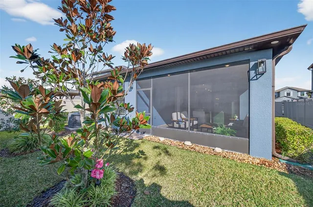 a living room filled with furniture and floor to ceiling window