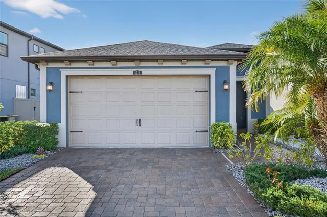 a view of swimming pool with a yard and large tree