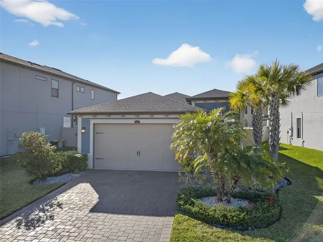an aerial view of a house with a garden