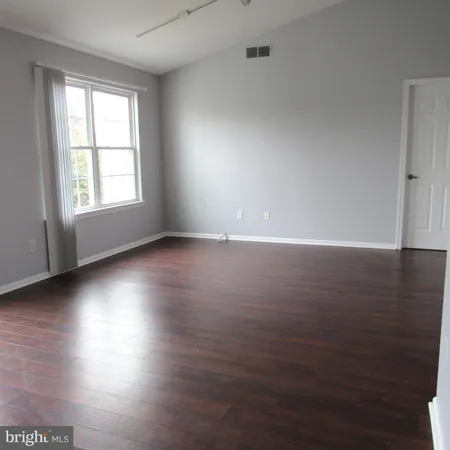 a balcony with trees in front of it