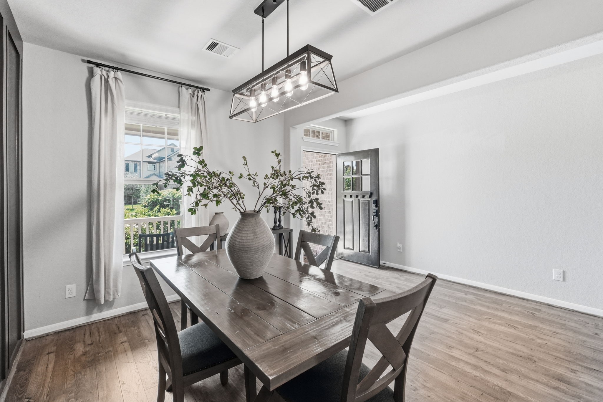 4334 Umber Shadow Drive Spring, TX 77386 - Photo 10 of 45 Dining area is framed by expansive windows that fill the space with natural light while offering views of the surrounding landscape.