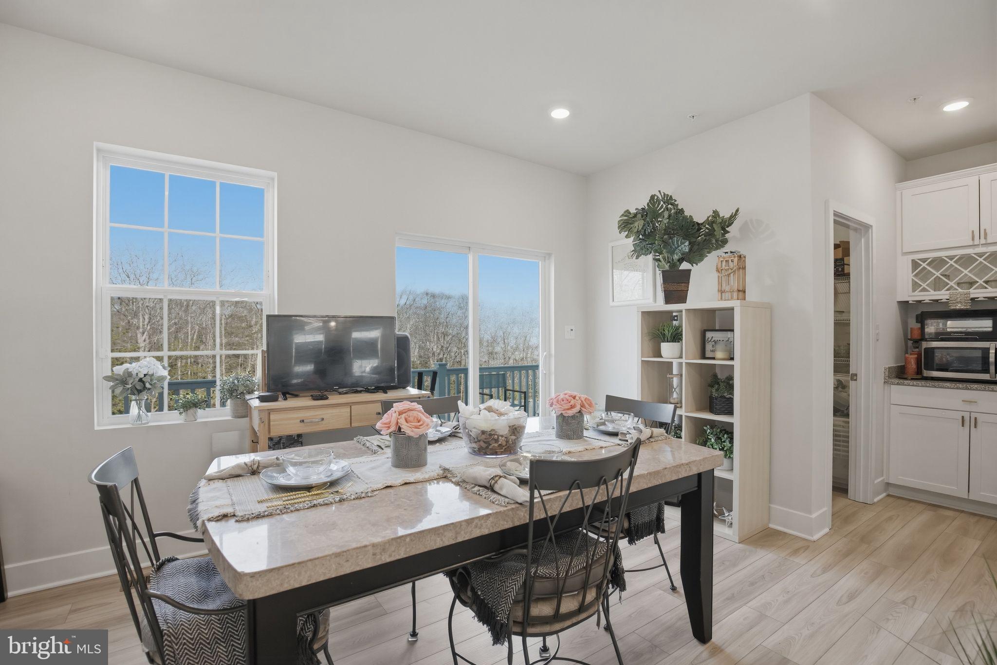 23609 Crosswinds Way California, MD 20619 - Photo 11 of 29 a dining room with livingroom view and wooden floor