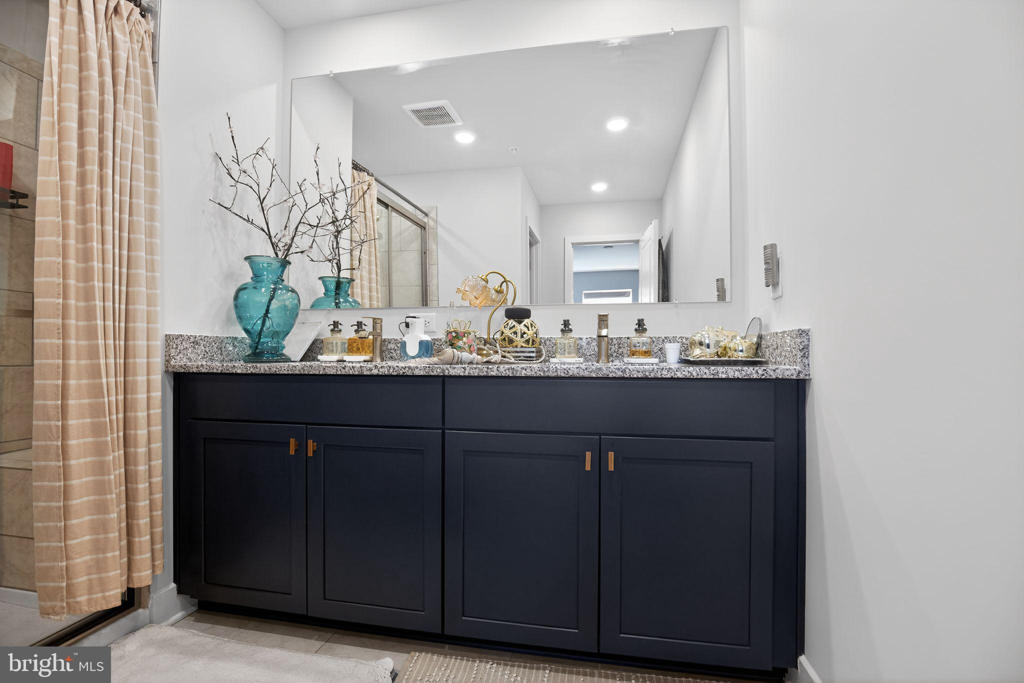 23609 Crosswinds Way California, MD 20619 - Photo 20 of 29 a bathroom with a sink and a mirror