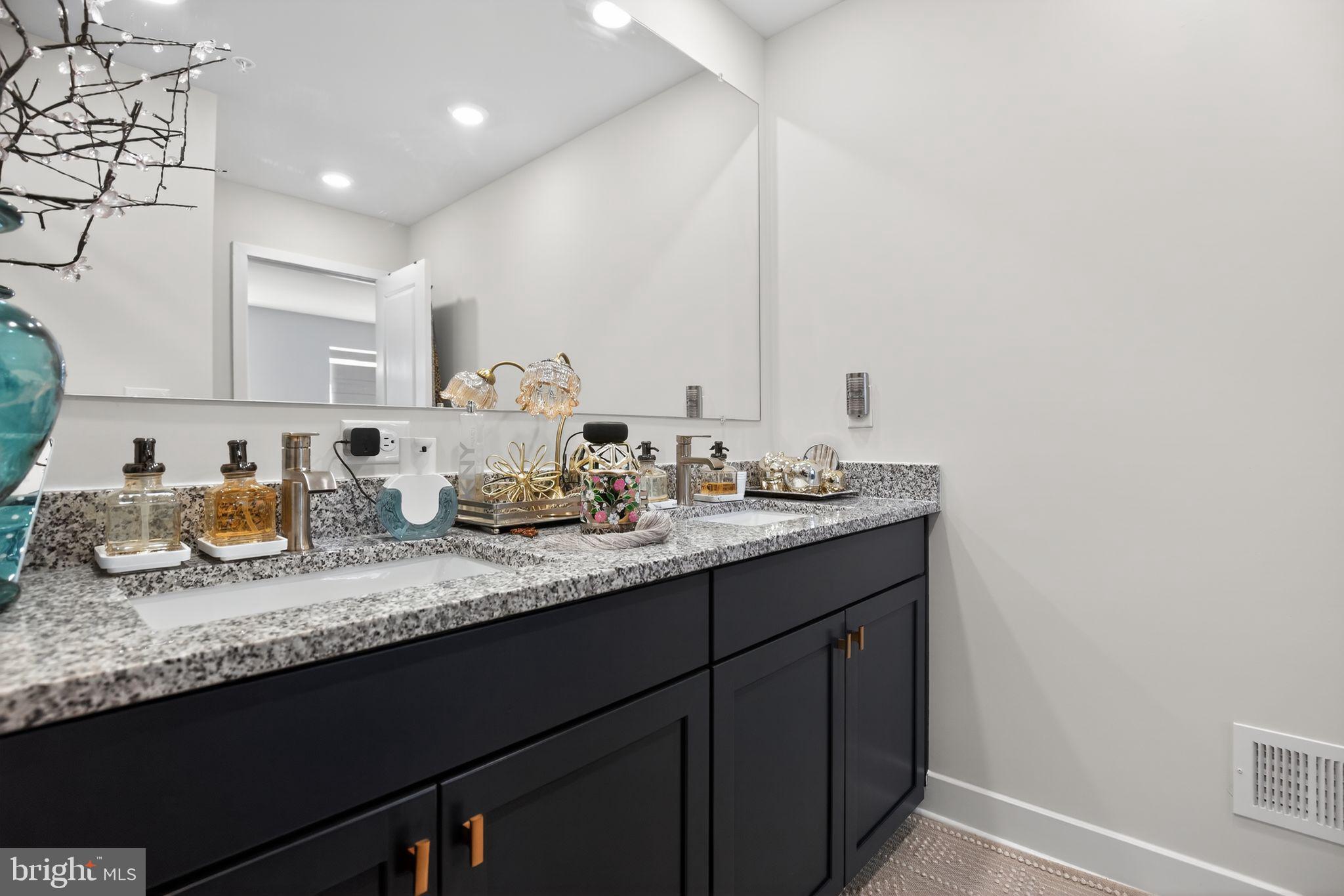 23609 Crosswinds Way California, MD 20619 - Photo 21 of 29 a bathroom with double sink and a mirror