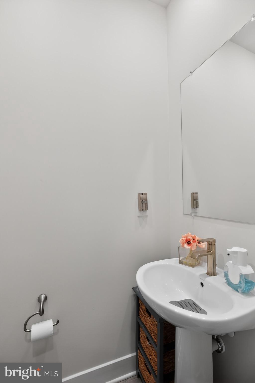 23609 Crosswinds Way California, MD 20619 - Photo 22 of 29 a bathroom with a sink and a mirror