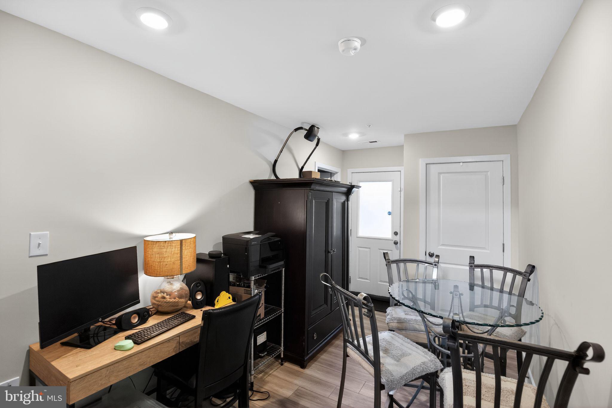 23609 Crosswinds Way California, MD 20619 - Photo 26 of 29 a workspace with furniture and wooden floor