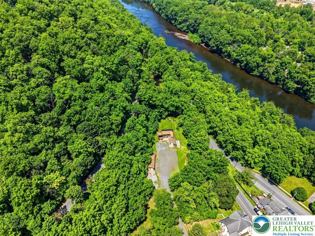 5340 2nd Street Whitehall, PA 18052 - Photo 29 of 30 Perched riverside, this verdant oasis offers a private escape amidst nature's grandeur.