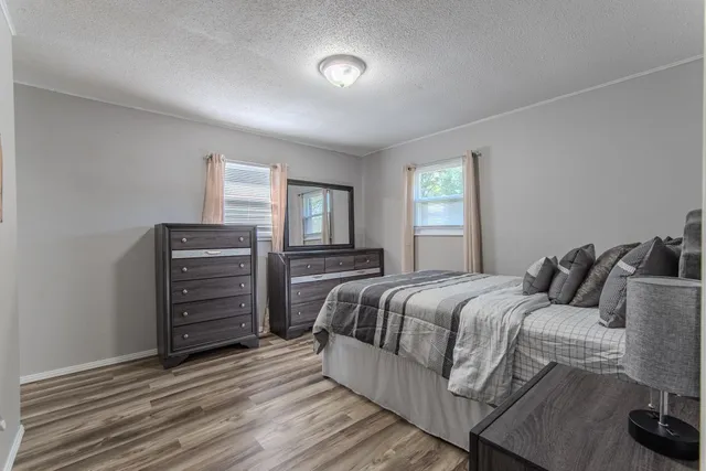 a bedroom with a bed and a closet