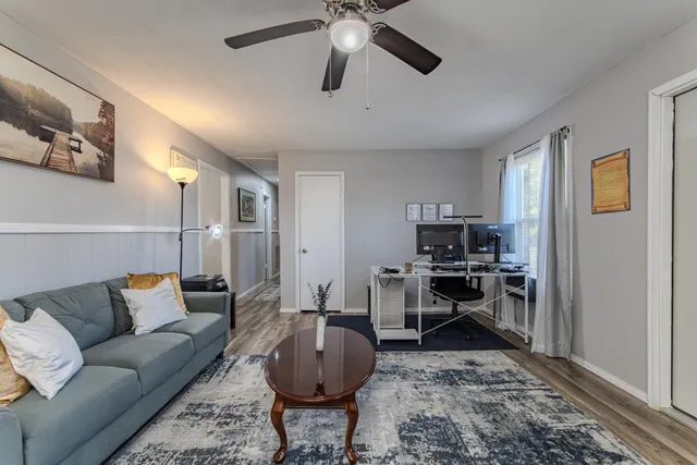 a living room with furniture and a rug